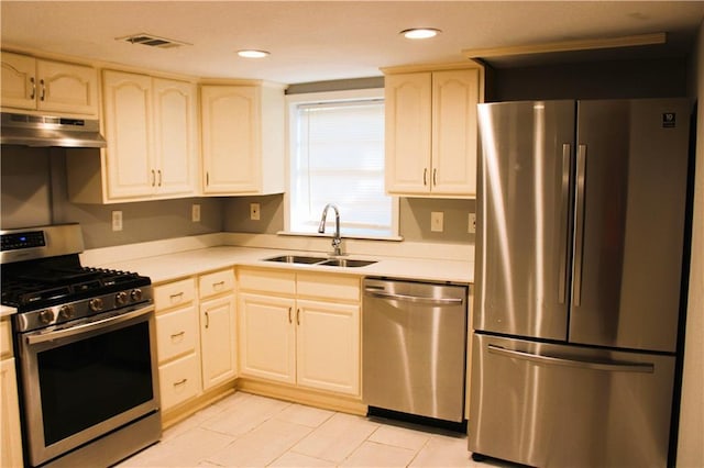 1831 S Dupre St, New Orleans, LA 70125 - kitchen featuring light countertops, under cabinet range hood, visible vents, appliances with stainless steel finishes, and a sink
