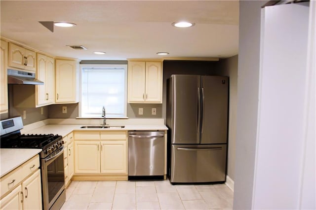 1831 S Dupre St, New Orleans, LA 70125 - kitchen with light countertops, under cabinet range hood, visible vents, stainless steel appliances, and a sink