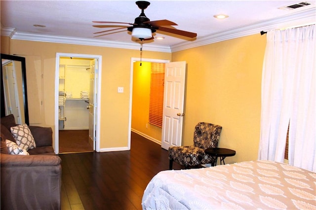 1831 N Miro St, New Orleans, LA 70119 - bedroom with ornamental molding, visible vents, a walk in closet, and hardwood / wood-style floors