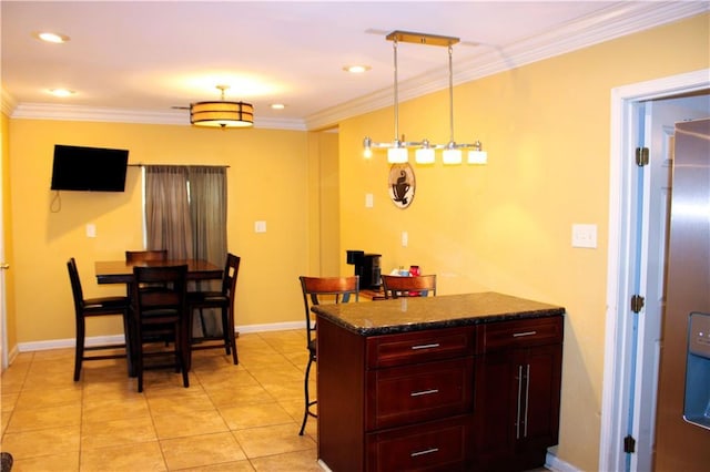 1831 N Miro St, New Orleans, LA 70119 - kitchen with baseboards, ornamental molding, light tile patterned flooring, a breakfast bar area, and reddish brown cabinets