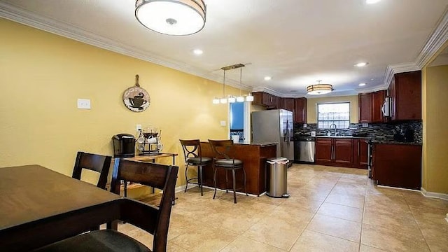 1831 N Miro St, New Orleans, LA 70119 - kitchen featuring ornamental molding, dark countertops, a sink, stainless steel appliances, and decorative backsplash
