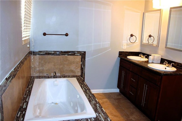 1831 N Miro St, New Orleans, LA 70119 - bathroom featuring tile patterned flooring, double vanity, a sink, and a tub with jets