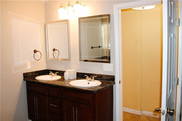 1831 N Miro St, New Orleans, LA 70119 - full bath with tile patterned floors, double vanity, and a sink