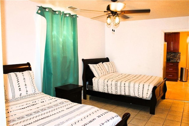 1831 N Miro St, New Orleans, LA 70119 - bedroom featuring light tile patterned flooring, a ceiling fan, and visible vents