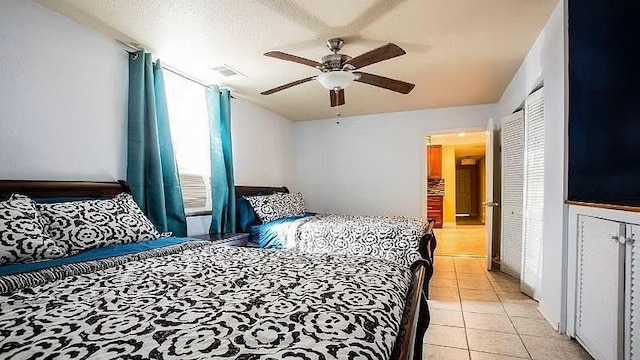 1831 N Miro St, New Orleans, LA 70119 - bedroom featuring light tile patterned floors, visible vents, a textured ceiling, and ceiling fan