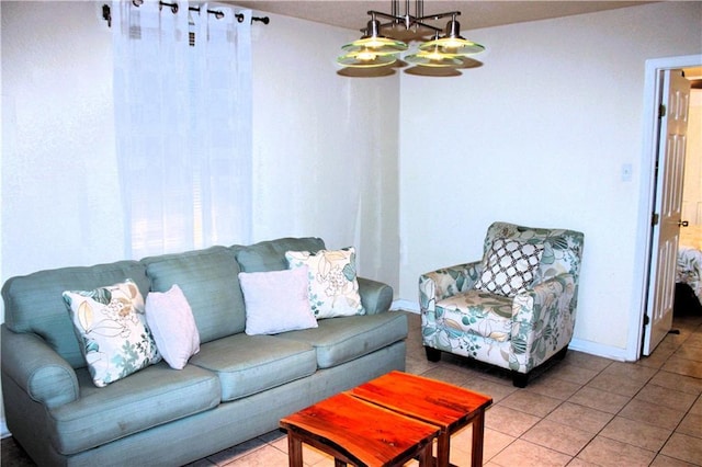 1831 N Miro St, New Orleans, LA 70119 - living area with a chandelier, light tile patterned floors, and baseboards