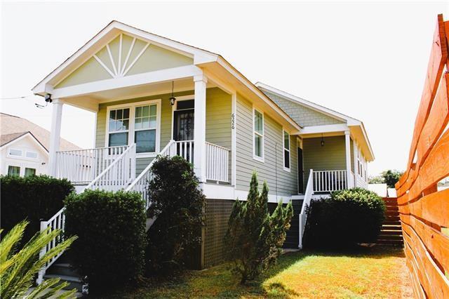 8002 Trapier Ave, New Orleans, LA 70127 - view of front of home featuring covered porch, stairs, and fence
