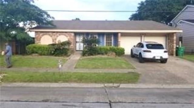 8002 Trapier Ave, New Orleans, LA 70127 - single story home with driveway and an attached garage