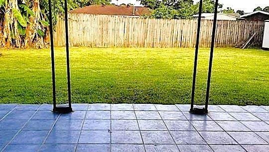 8002 Trapier Ave, New Orleans, LA 70127 - view of yard featuring a patio and a fenced backyard
