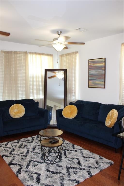 living room with ceiling fan and hardwood / wood-style flooring