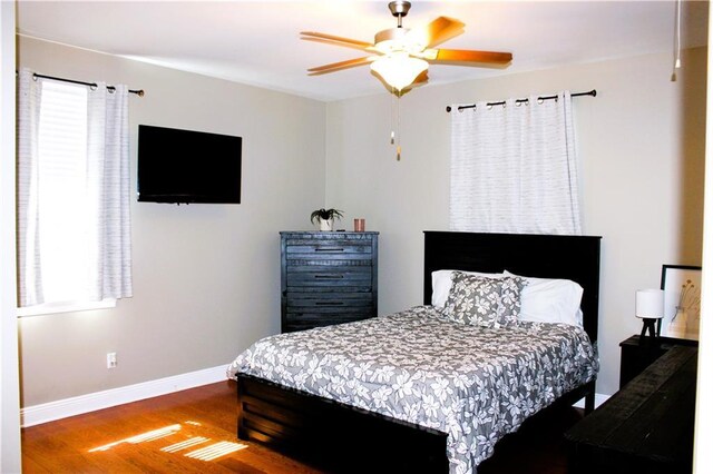 6226 Lafaye St, New Orleans, LA 70122 - bedroom with baseboards, a ceiling fan, and wood finished floors