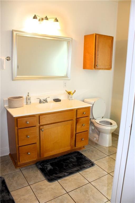 6226 Lafaye St, New Orleans, LA 70122 - bathroom with tile patterned flooring, toilet, and vanity