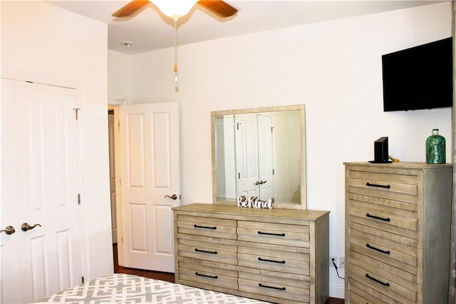 bedroom with ceiling fan and a closet