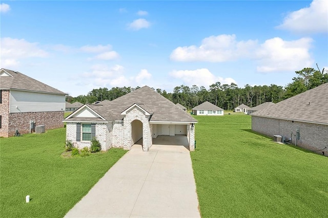 view of front of house with brick siding, driveway, central AC, and a front yard