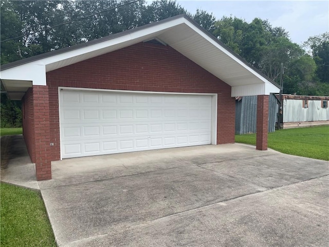 garage with a lawn