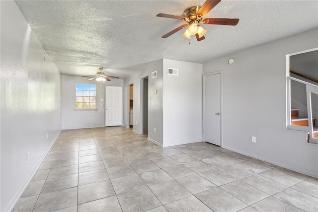 3 Shepard Ct, New Orleans, LA 70114 - empty room featuring visible vents, a ceiling fan, a textured ceiling, and light tile patterned floors