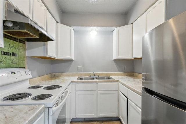 3 Shepard Ct, New Orleans, LA 70114 - kitchen with white electric range, a sink, freestanding refrigerator, under cabinet range hood, and white cabinetry