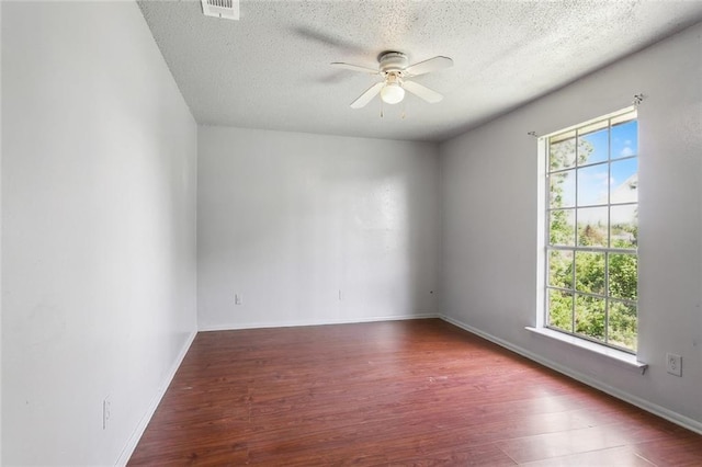 3 Shepard Ct, New Orleans, LA 70114 - unfurnished room featuring a textured ceiling, a ceiling fan, baseboards, wood finished floors, and visible vents