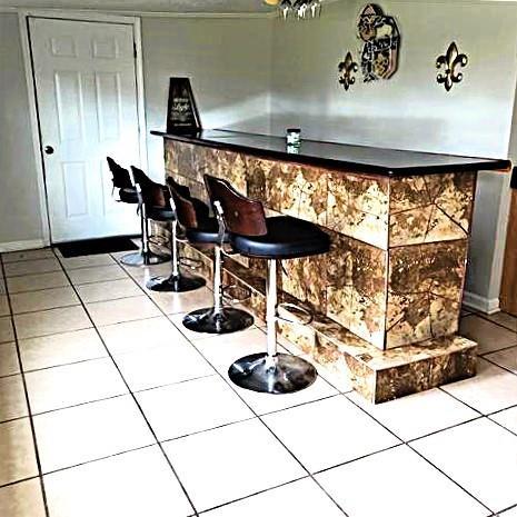 bar featuring tile patterned flooring and tile countertops