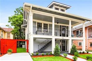 back of property featuring a balcony