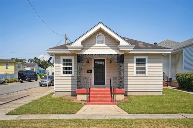 bungalow with a front yard