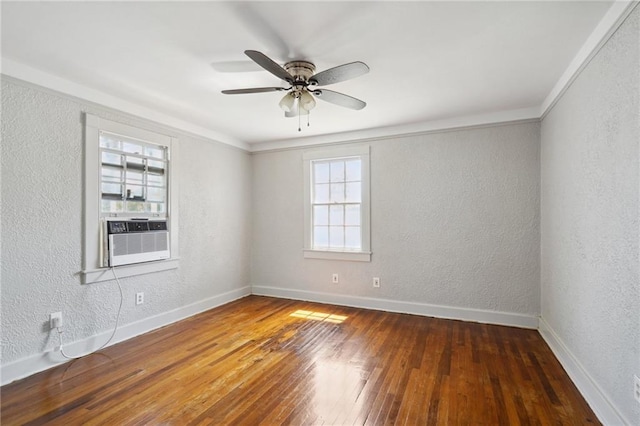 unfurnished room with hardwood / wood-style floors, ceiling fan, and cooling unit