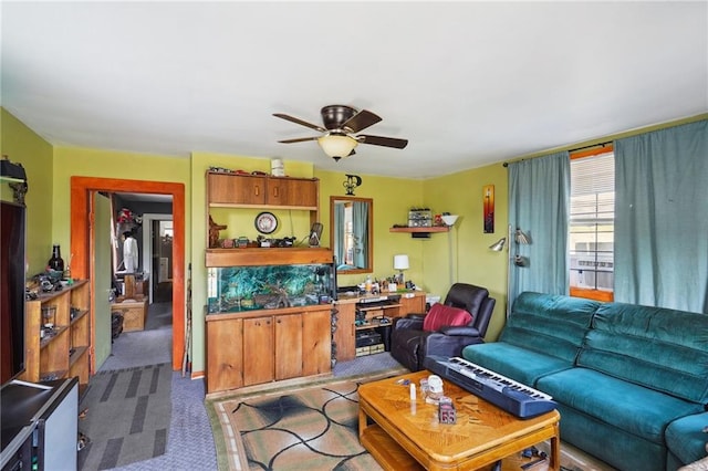 living room with carpet floors and ceiling fan