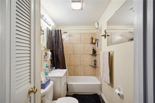 full bathroom with toilet, vanity, and shower / bath combo