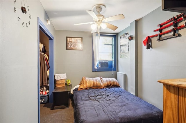 bedroom with a closet, ceiling fan, cooling unit, and carpet flooring