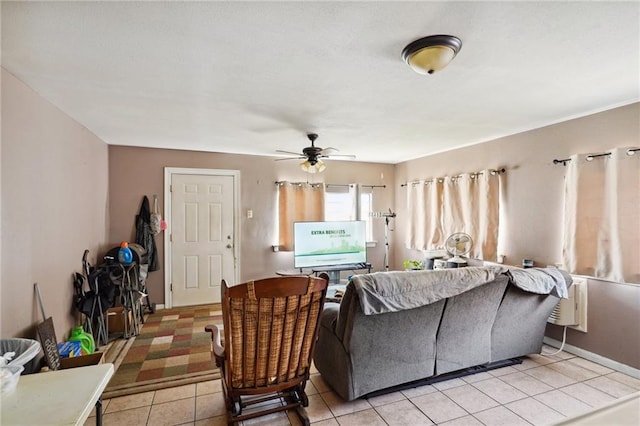 living room with ceiling fan and light tile patterned flooring