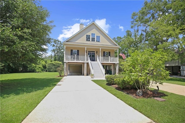 view of front of property with a front lawn, a porch, and a garage