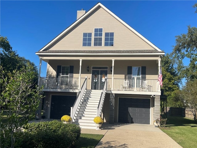 view of front of home with a garage and covered porch