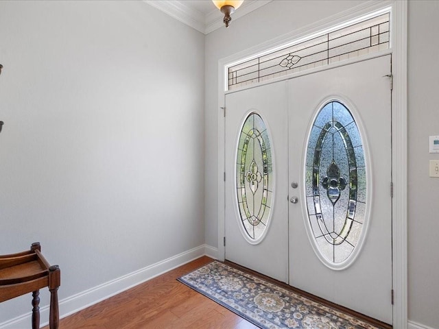 entrance foyer with french doors, ornamental molding, and hardwood / wood-style floors