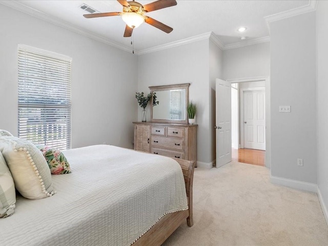 bedroom with ceiling fan, light colored carpet, and ornamental molding