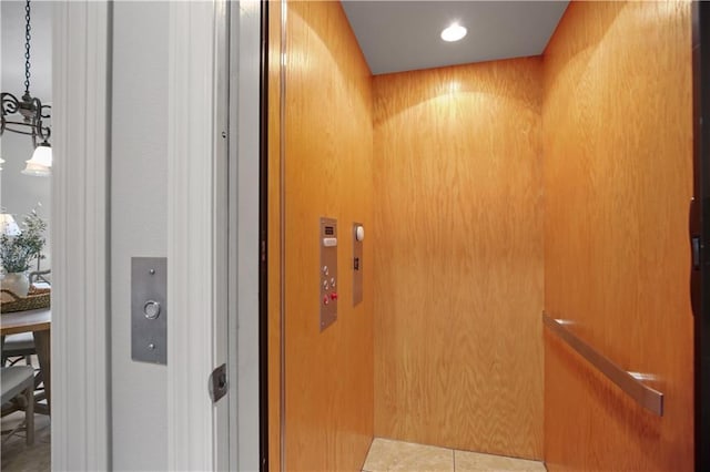 room details with wood walls and elevator