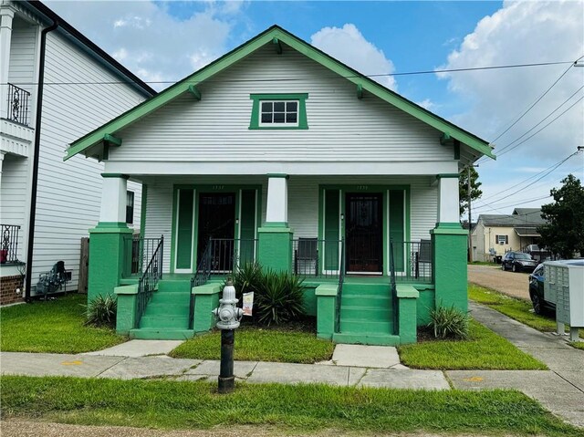 bungalow featuring covered porch