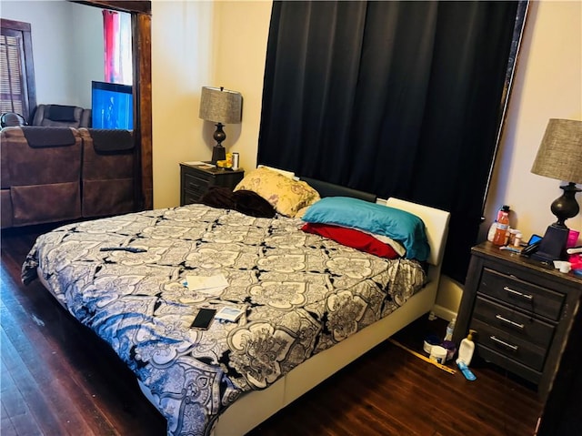 bedroom with wood-type flooring