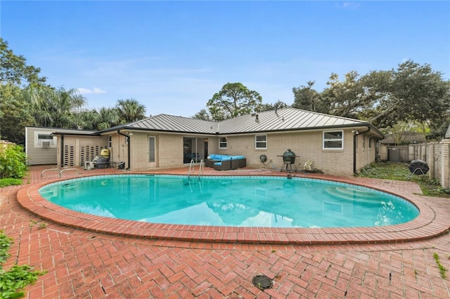 view of pool featuring a patio