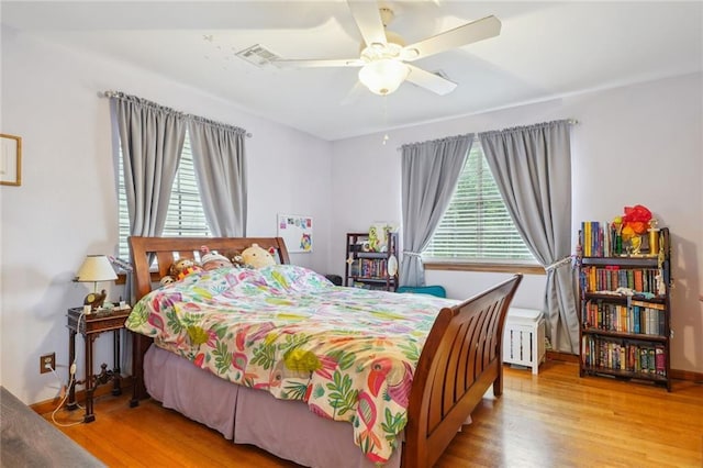 bedroom featuring light wood-type flooring and ceiling fan