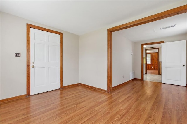 spare room with light hardwood / wood-style floors