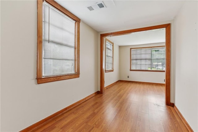 spare room featuring light hardwood / wood-style flooring