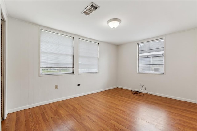 unfurnished room featuring light wood-type flooring