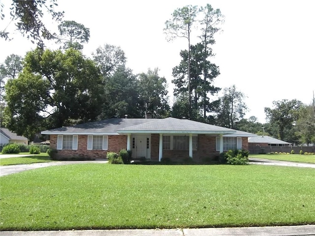 ranch-style house with a front lawn