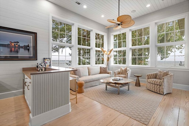 sunroom / solarium with ceiling fan