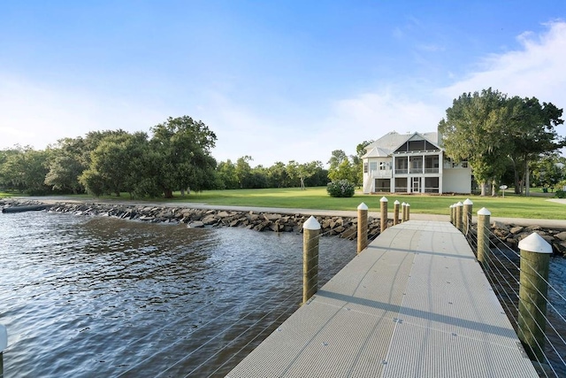 dock area featuring a yard and a water view