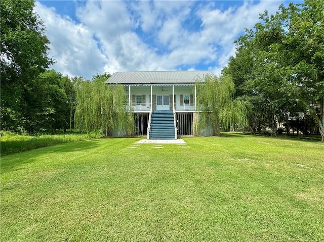 back of house with a yard