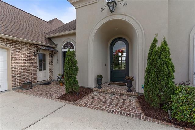 property entrance featuring central AC unit