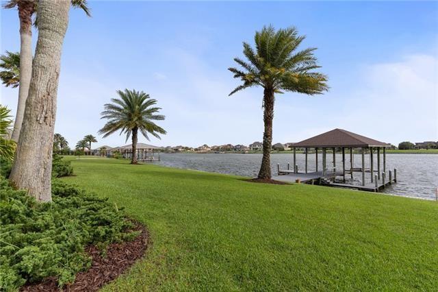 exterior space with a lawn and a water view