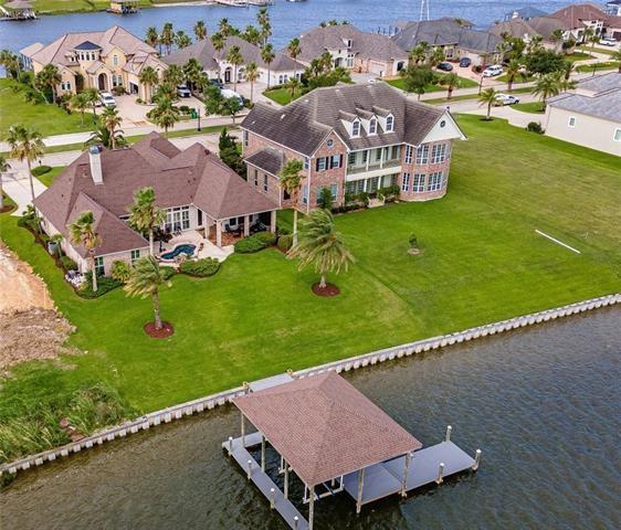 drone / aerial view featuring a residential view and a water view