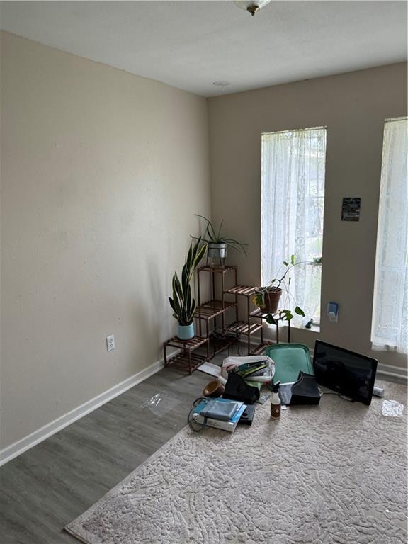 sitting room with hardwood / wood-style flooring